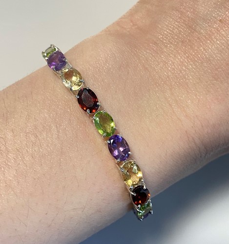 Lot 3 - A multi-gem set line bracelet