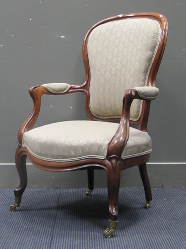 Lot 509 - A Victorian mahogany frame spoonback armchair