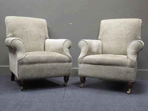 Lot 583 - A pair of modern easy armchairs on turned...