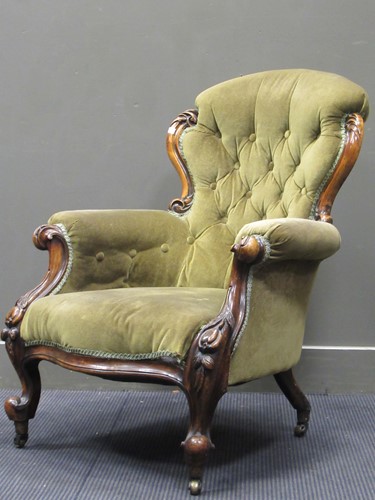 Lot 459 - A Victorian carved walnut button back armchair...