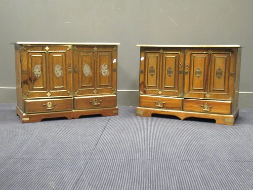 Lot 486 - An elm or hardwood and brass bound low cabinet,...