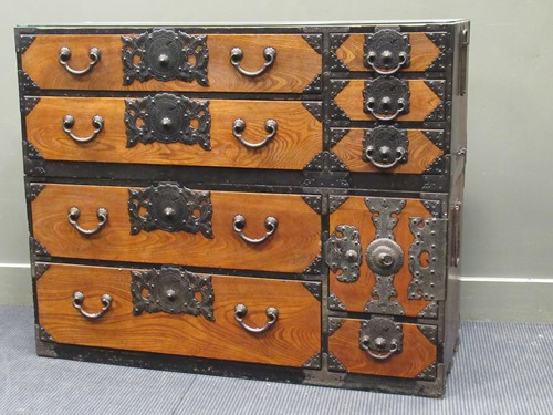 Lot 494 - An East Asian two part elm chest of drawers...