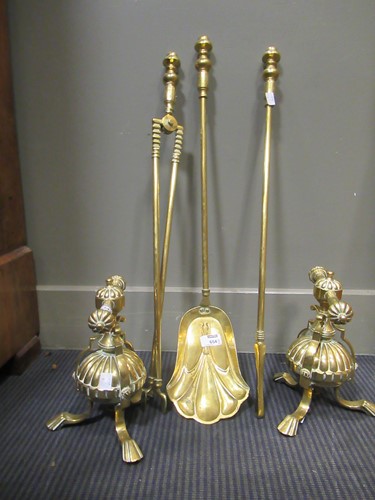 Lot 654 - A set of Arts & Crafts brass fire irons and...