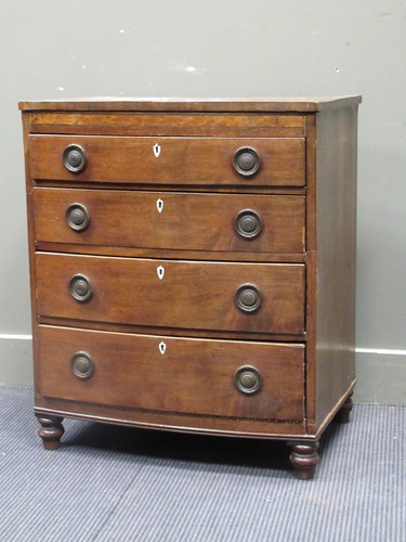 Lot 515 - A small Regency mahogany bow front chest of...