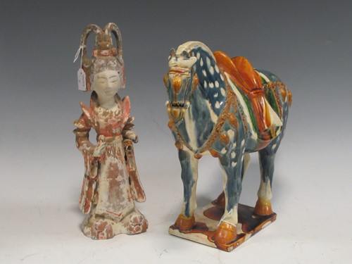 Lot 86 - A modern polychrome decorated pottery figure,...