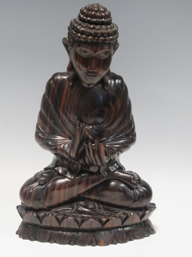 Lot 91 - A modern carved hardwood figure of the Buddha...