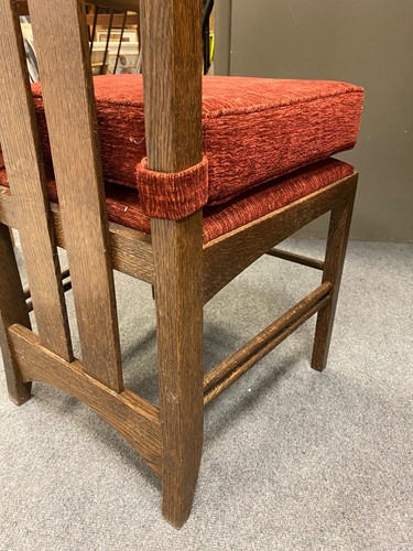 Lot 175 - In the manner of Charles Rennie Mackintosh, a modern oak dining table and four chairs