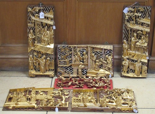 Lot 138 - A collection of oriental carved wood and gilt...