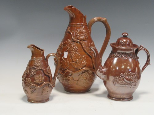 Lot 78 - Three 19th century stoneware jugs with raised...