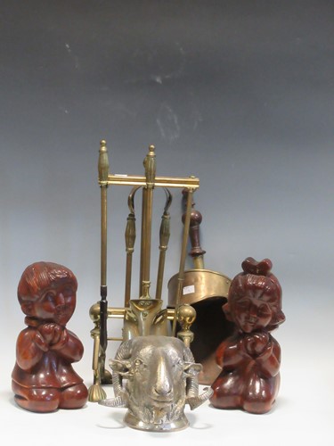 Lot 656 - A set of fireside implements on a stand, a...