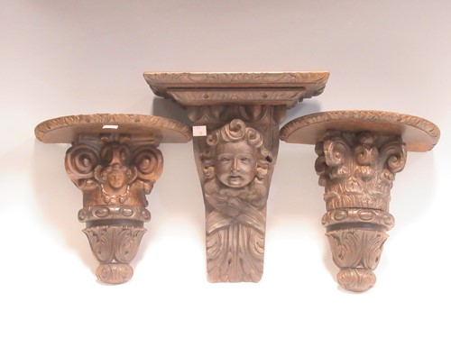 Lot 56 - Three antique wooden brackets and two other...