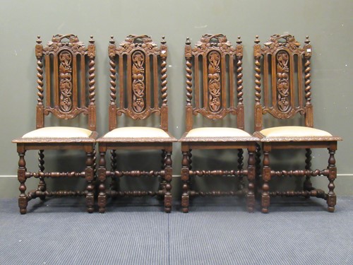 Lot 445 - A set of four Victorian caved oak high back...