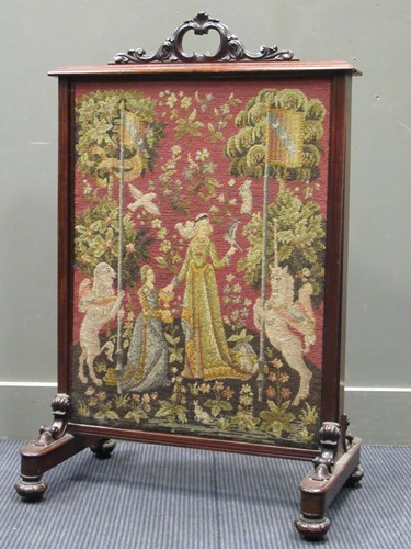 Lot 442 - A Victorian firescreen with pull up needlework...