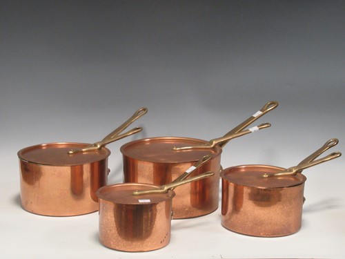 Lot 171 - A set of four copper saucepans and lids with...