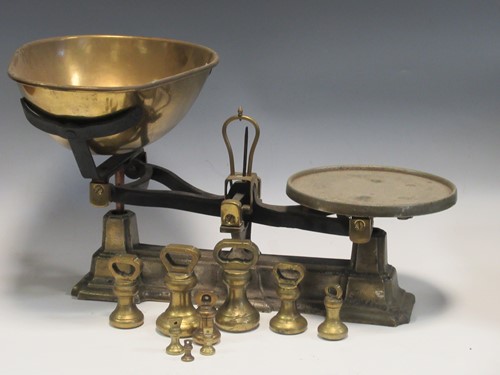 Lot 118 - A set of cast iron kitchen scales with a...