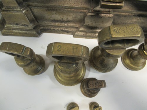 Lot 118 - A set of cast iron kitchen scales with a...