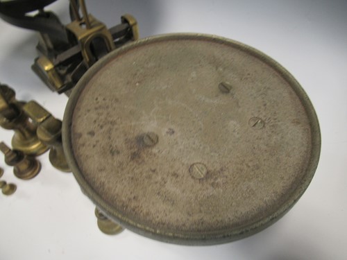 Lot 118 - A set of cast iron kitchen scales with a...