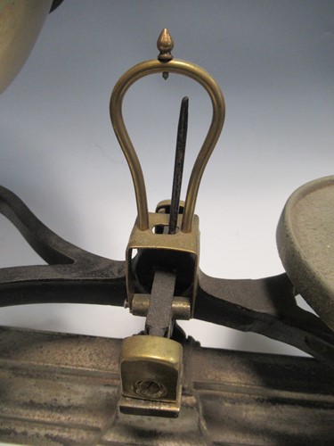 Lot 118 - A set of cast iron kitchen scales with a...
