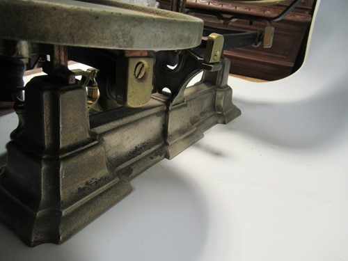 Lot 118 - A set of cast iron kitchen scales with a...
