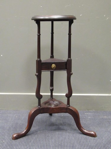 Lot 543 - A Georgian style mahogany wig stand with wash...