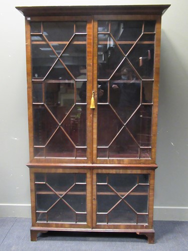 Lot 485 - A 19th Century mahogany bookcase enclosed by...