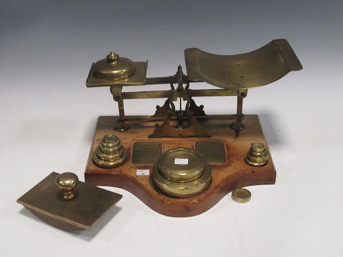 Lot 10 - A set of postal scales and weights with rates...