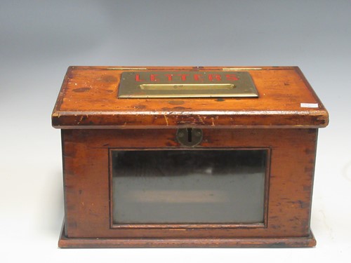 Lot 83 - A rectangular pine mailing box, the hinged top...