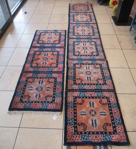 Lot 712 - Two Chinese runners with panel decoration...
