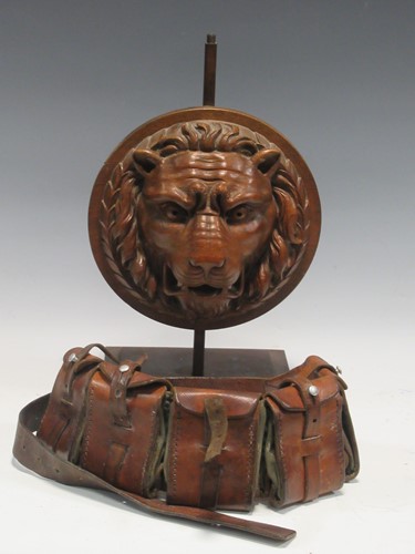 Lot 72 - A carved oak lions mask plaque mounted as a...