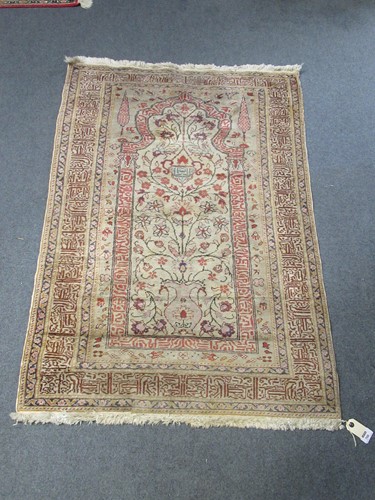 Lot 708 - A Turkish part silk prayer rug the mihrab with...