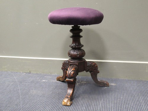 Lot 461 - A late Victorian carved piano stool with...