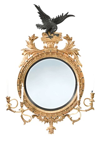 Lot 308 - A gilt and ebonised circular girandole in the Georgian style