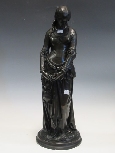 Lot 136 - A bronzed figure of a maiden staring pensively...