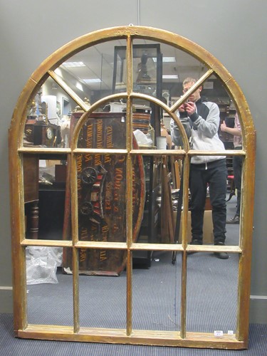 Lot 473 - A modern arched window pattern wall mirror...