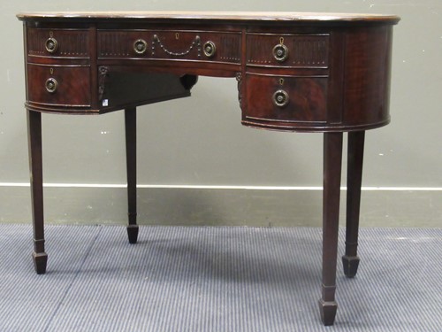 Lot 643 - An early 20th Century kidney shape writing...