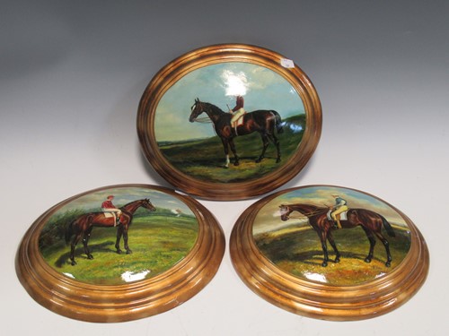 Lot 165 - Three painted oval plaques of race horses and...