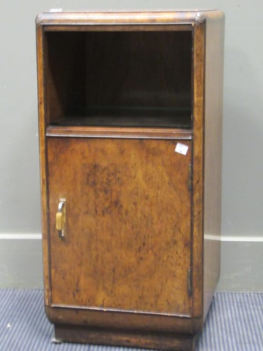 Lot 447 - An Art Deco walnut bedside cabinet with an...