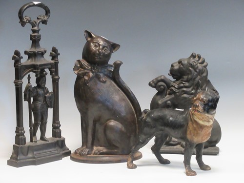 Lot 657 - A painted cast iron pug dog pattern door stop,...