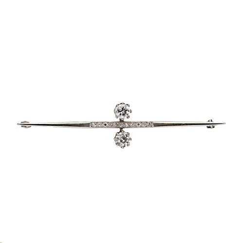 Lot 125 - A mid 20th century two stone diamond bar brooch