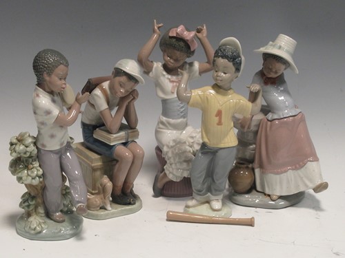 Lot 28 - A collection of Lladro figurines of children,...