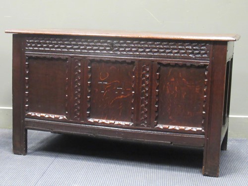 Lot 634 - An 18th century pegged oak three panel coffer,...
