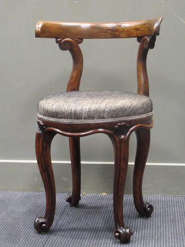 Lot 441 - An early Victorian oak chair, the curved back...