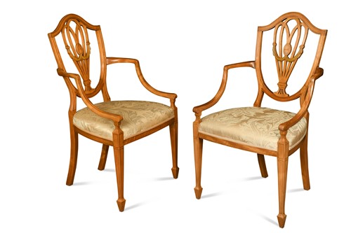 Lot 327 - A pair of Sheraton style satinwood shield back elbow chairs