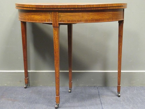 Lot 649 - A Edwardian satinwood D-shape fold-over card...