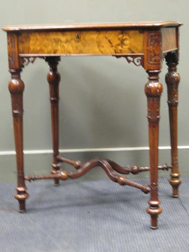 Lot 602 - A Victorian figured walnut sewing table, 70.5...