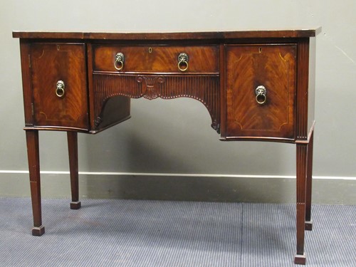 Lot 604 - An early 20th century mahogany serpentine...