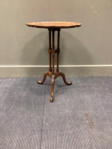 Lot 607 - A nest of walnut tables and an occasional...