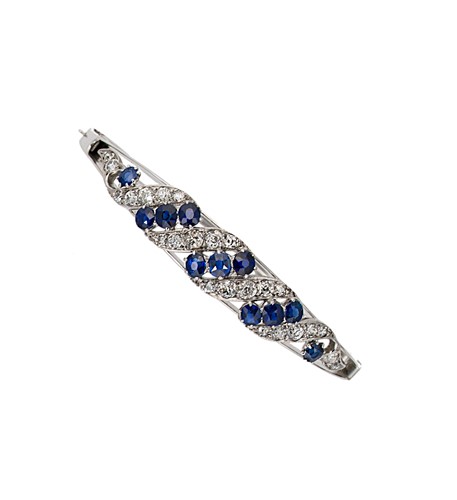 Lot 170 - A sapphire and diamond hinged bangle