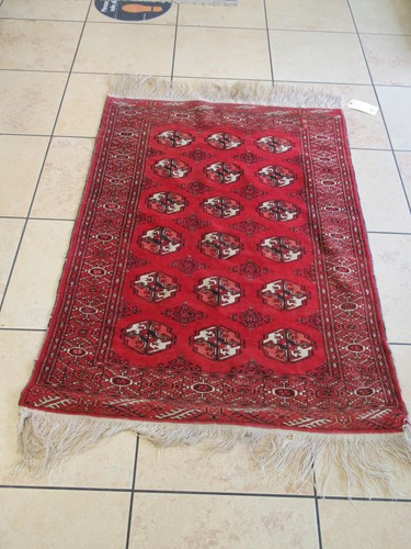 Lot 704 - Red ground Tekke type rug, 166 x 100cm, and...