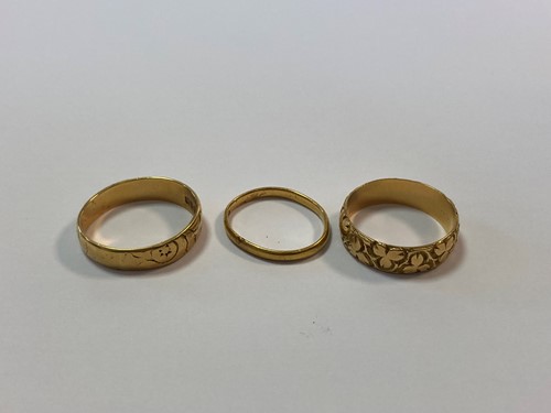 Lot 215 - two hallmarked 18ct gold rings, gross weight 9....